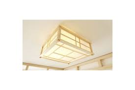 The trim is the same color as the covering. Japanese Ceiling Lamp Hikari In Solid Pine Wood Natural Rice Paper