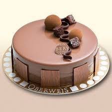 The Perfect Harmony Of Smooth And Rich Dark Chocolate Mousse Light Chocolate Genoise Laced With Dark Rum With A Delicately C Fancy Desserts Cake Recipes Cake