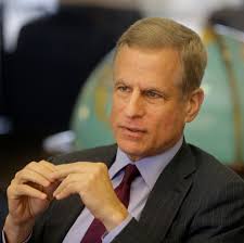 The Fed will re-examine ethics rules after trades by two officials drew  scrutiny.