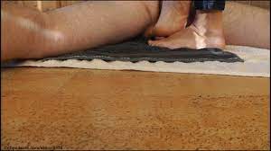 Michaela toequeen tramples his poor cock softly with her large soles until  cum releasing in moans