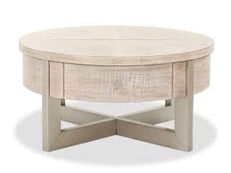 The delightfully simple round end table represents clean living at its best; Contemporary Lift Top Cocktail Table In Whitewash Mathis Brothers Furniture