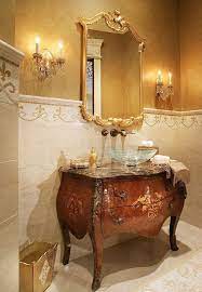 Luxurious Powder Room With Elegant Louis Xv Style Carved Mirror Crystal Sconces And Inlaid Luxury Powder Room Bathroom Interior Design French Country Bathroom