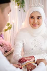 On this joyous occasion, everything has to be perfect for the muslim bride and groom like venue, catering, wedding photography, and, most importantly, the wedding dress. A Muslim Bride Getting Solemnization Malay Traditional Wedding Stock Photo Picture And Royalty Free Image Image 158649741