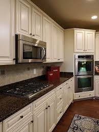 Existing Obsessions 8 Heavenly Kitchens With White Granite Countertops Antique White Kitchen Antique White Kitchen Cabinets Brown Granite Countertops