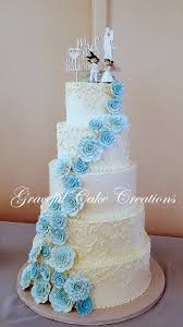 The blue ice effect was made with blue dyed rolled fondant icing, it was cut out into zig zaggy shapes and positioned on top of each cupcake. Elegant White Butter Cream Wedding Cake With Baby Blue Sugar Paste Roses A Photo On Flickriver