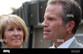 Michigan Republican gubernatorial candidate, Mike Cox, hugs his son Rory  after conceding the primary election race to businessman Rick Snyder