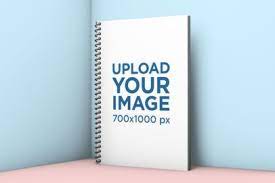 Download Placeit Spiral Notebook Mockup Standing Against A Solid Surface