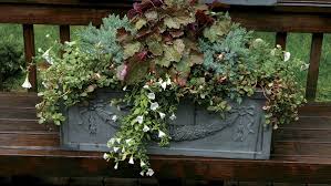 Not only does this look great and rustic, the wagon lifts the planter adding interesting depth to the outdoor space. 10 Plants For Year Round Containers Finegardening