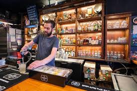 Seattle's beloved Kraken bar has a new location with the same cool vibe