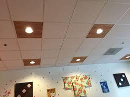 Drop ceilings are an easy solution to ugly pipes, wiring and other ceiling issues, but aging ceiling tiles can become discolored and stained. Great Alternative To Drop Ceiling Lighting Drop Ceiling Lighting Dropped Ceiling Ceiling Lights