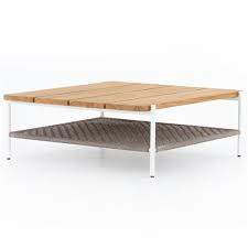 Made from hundreds of reclaimed teak wood pieces, this coffee table is put. Annie Modern Brown Teak Wood White Aluminum Outdoor Coffee Table 41 W 50 W Kathy Kuo Home