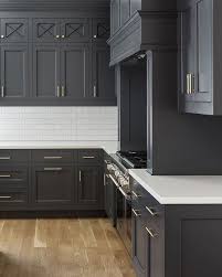 The marble herringbone tile backsplash lends pattern. Kitchen With Gray Cabinets Why To Choose This Trend Decoholic Luxury Kitchen Cabinets Grey Kitchen Designs Kitchen Tiles Design