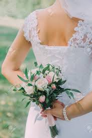 Maybe you would like to learn more about one of these? Beautiful Wedding Bouquet In Hands Of The Bride Peony Rose Cotton Roses Pink And Peach Trendy And Modern Wedding Flowers Ideal Photo For Commercial Stock Photo Picture And Royalty Free Image Image