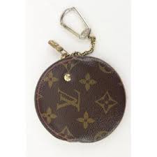 Its features include double zips with a padlock, two inside compartments, leather key tag, toron handles, an additional shoulder strap, and protective bottom studs. Louis Vuitton Monogram Cherries Round Coin Pouch Change Keychain Purse 293lvs513