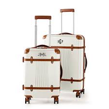• on the reverse side of each lock you will see a small black button that you can push forward and backward. White Terminal 1 Checked Carry On Spinner Luggage Set Mark And Graham