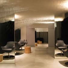 hair salon in zurich switzerland by zurich designer claudia meier white translucent fibres hanging from the ceiling with salon chic salon salon de coiffure