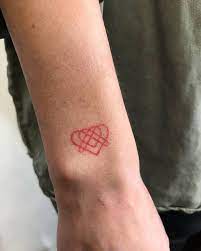 Small Hand Poked Red Heart On The Wrist Red Ink Tattoos Ink Tattoo Red Ink Tattoo