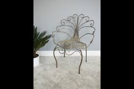 This is a vintage wrought iron peacock chair! Peacock Retro Chair Gold Metal Painted Distressed Bedroom Outside Patio Vinterior