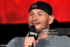 Retired mixed martial artist Guy Mezger speaks during a panel... News Photo 