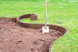 Try tidying up the various areas with landscape edging borders. 5m Easy Lawn Edging In Brown H14cm By Smartedge 26 99