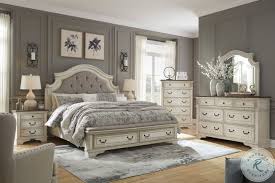 Tops feature oak veneers, while the cases are made with birch veneers and hardwood solids. Realyn Chipped White Queen Upholstered Panel Bed With Bench Footboard From Ashley Coleman Furniture
