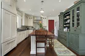 Start by sanding and conditioning the wood, then stain. Trend Alert Mixed Cabinet Finishes In The Kitchen