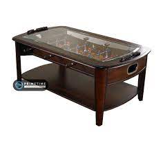 It has a glass top above the foosball playing surface and a lower shelf below. Signature Foosball Coffee Table Primetime Amusements