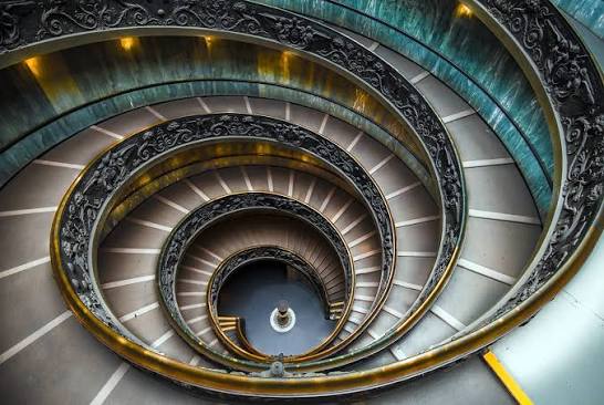 Curving stone staircase viewed from above