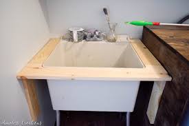 Now that we know that it is in an apartment, we know that there is not much you can do except perhaps the 2 sinks were outside on a large counter and mirror between the rooms with the bathtub and toilet. Diy Utility Sink Makeover Timeless Creations