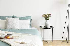 Furniture rolling storage from up cycled wine crates black. Close Up Of A Bed With Pale Sage Green And White Linen Pillows And A Blanket In A Sunny Bedroom Interior A Round Black Metal Sid Stock Image Image Of Fresh Black