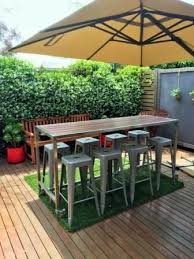 The clean design features everything you'd want for hosting including a tempered glass top for easy drink placement, 2 comfortable chairs that curve to the body and a canopy top to provide. Custom Outdoor Bar Table With Foot Rail Lockable Castors And Jarrah Timbers By Outdoor Table Creations Outdoor Bar Table Patio Bar Set Outdoor Patio