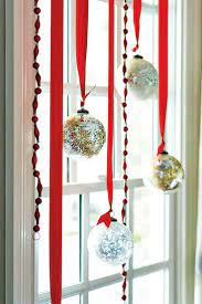 7 Festive Decorations To Hang In Your Windows For The Holidays Christmas Window Decorations Christmas Apartment Christmas Decor Diy
