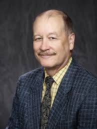 John Lowe: "a guardian angel . . in a cap and blue seer sucker suit"