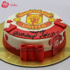 Vanilla sponge with football accessories. Manchester United Cake With Fondant