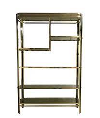 In stock & ready to ship. Vintage Brass Smoked Glass Shelving Unit 1970s 106469