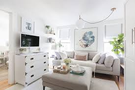 Using lucite or glass products in your small apartment layout help the space feel much airier. Tour The 500 Sq Ft Apartment That Made Our Editors Gasp Condo Living Room Stylish Living Room Condo Interior Design