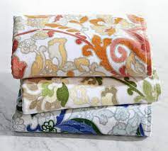 Use bath towels to jazz up a bathroom by picking colors that play off of the walls, fixtures, flooring or existing decorative accents. Valentina Printed Bath Towels Pottery Barn