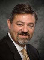 C. Michael Ogle, Physician, Management