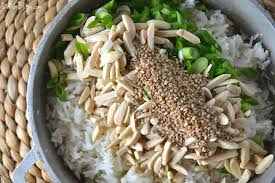 Stir together the cooked brown rice, the dried fruit, both sugars and the cardamom in the crock pot. Toasted Almond Scallion Rice Delish D Lites