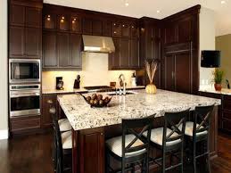 Keep it modern with a glossy tile backsplash and sculptural pendant lighting. Two Tone Kitchen Cabinets Ideas Concept With Modern Door Design And Painted With Dark Brown Kitchen Cabinets Brown Kitchen Cabinets Dark Wood Kitchen Cabinets