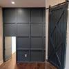 It features a sliding barn door wall, mindi and mahogany solids and veneers, and adjustable shelves for smart, flexible storage. 1