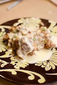 Combine ground beef, onion, eggs, tomatoes, oats, bacon, cheddar, 1/8 cup ketchup, mayonnaise, 1/2 tablespoon yellow mustard, salt and pepper in a large bowl. Cheeseburger Meatloaf Paula Deen
