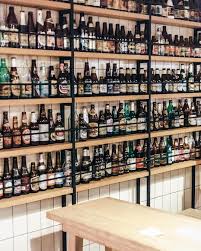 219 Likes 10 Comments We Heart We Heart On Instagram Amsterdam East S Brouwerij T Ij Has Got Plenty Of Bott Beer Store Brewery Bar Beer Bottle Display