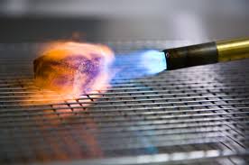 You don't want to try to preheat a large piece of metal with a small propane torch. Torch Tastes Modernist Cuisine