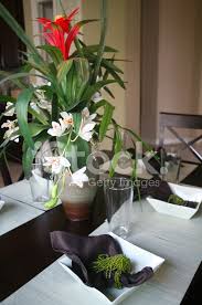 So, try to stick to potted plants like orchids for example which are very simple, very masculine. Dining Room Table With Floral Arrangement Stock Photos Freeimages Com