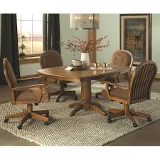 A perfect complement to the regal bucket bar and counter stools, this rolling chair offers a grounded choice for your table. Brooks Easy Living 214260 4x518c 5 Piece Caster Swivel Chair Dining Set Dean Bosler S Dining 5 Piece Sets