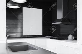 Try a lighter grey with a. Interior Of Modern Kitchen With Black Brick Walls White Countertops Stock Photo Picture And Royalty Free Image Image 115168872