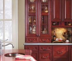 A Hallmark Of An Old World Kitchen Is Ornate Mouldings And Rich Finishes Artesia Burgundy Kitc Omega Cabinetry Kitchen Cabinets In Bathroom Old World Kitchens