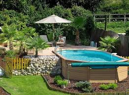 Above Ground Pool Options Would Love To Do This With Our Pool Some How Like The Look Small Backyard Design Backyard Pool Above Ground Pool Landscaping