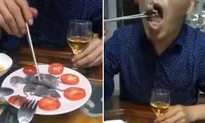 Asian Man Dips A Baby Mouse In A Bowl Of Sauce Before Eating It Alive Daily Mail Online